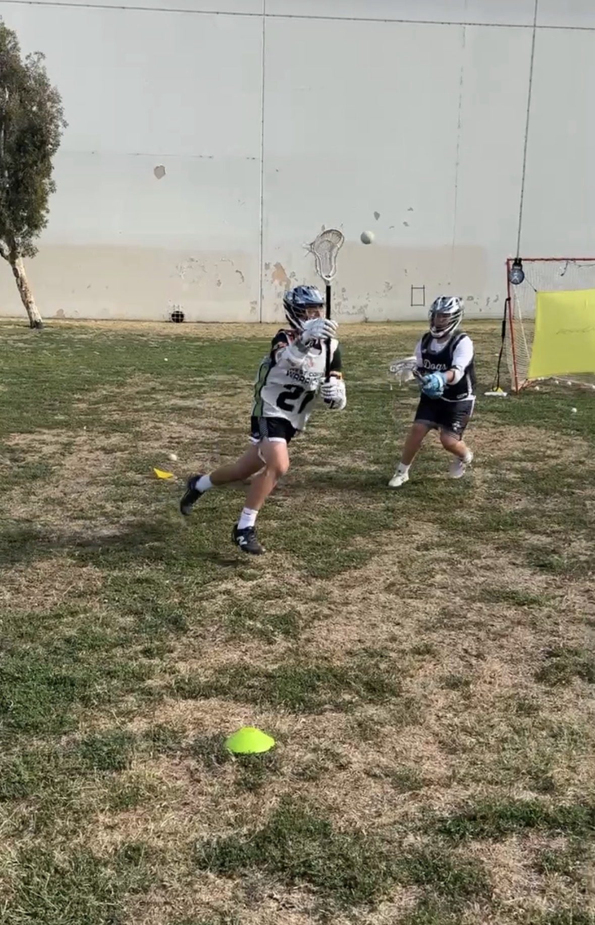 Sessions Lacrosse player working hard at the wall