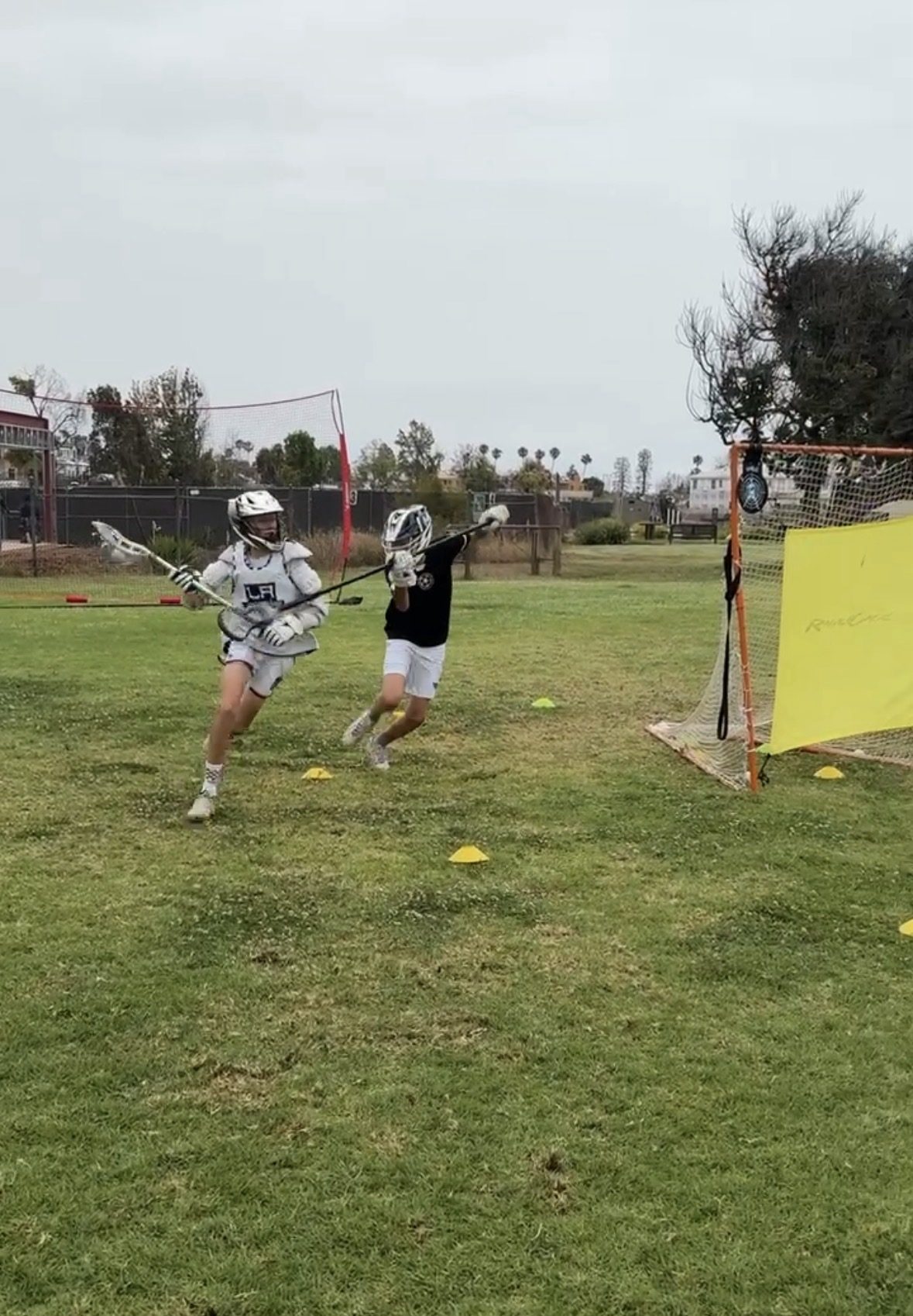 Sessions Lacrosse players in a live drill